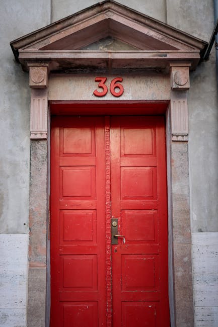 Historic ornate red entrance doors