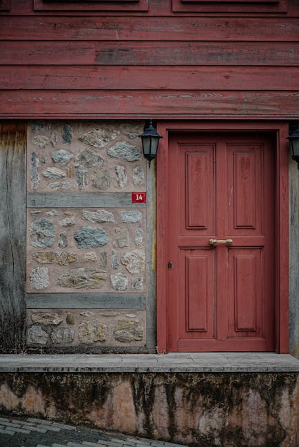 Rustic red door on stone cottage